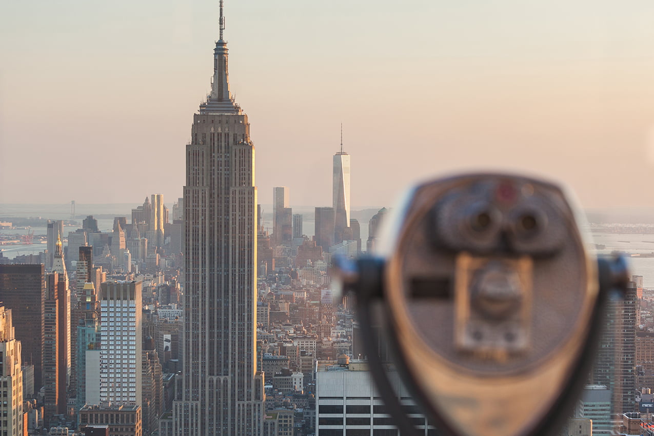Binocular with New York Skyscrapers on Background at Sunset